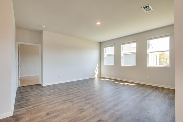 spare room featuring dark hardwood / wood-style floors