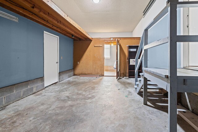 basement with a textured ceiling