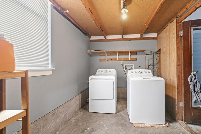 washroom with washing machine and clothes dryer