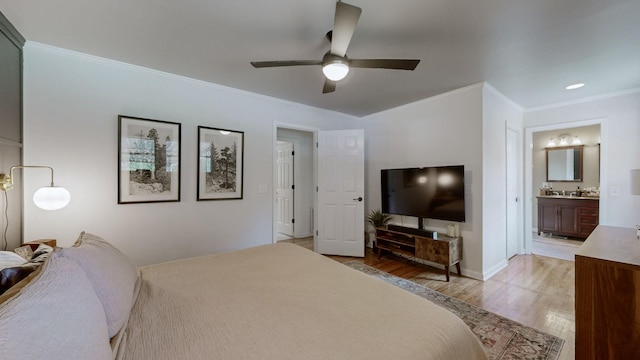 bedroom with ceiling fan, hardwood / wood-style floors, ensuite bathroom, and ornamental molding