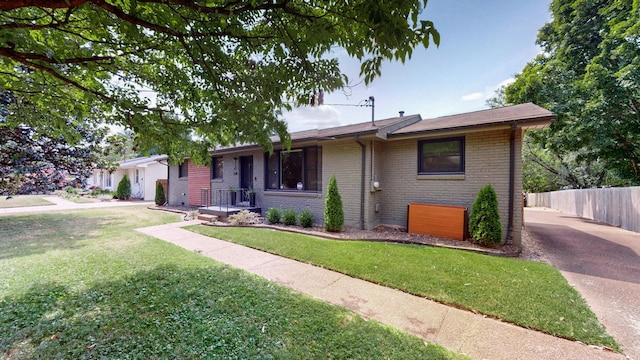 ranch-style house with a front yard