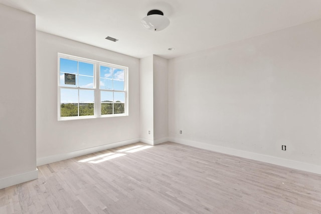 empty room with light wood-type flooring