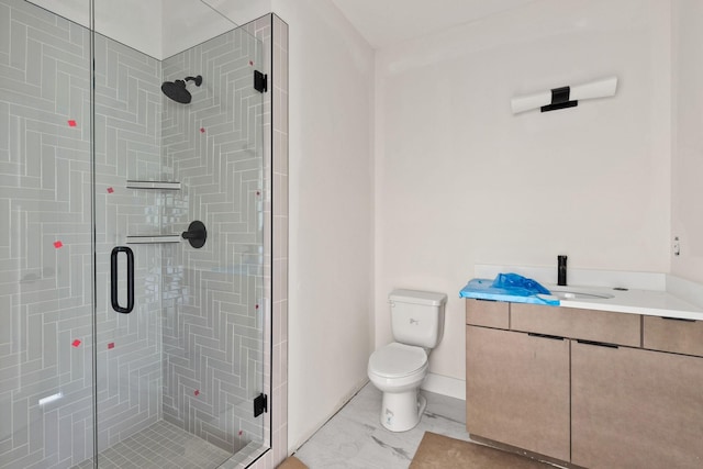 bathroom with a shower with door, toilet, and vanity