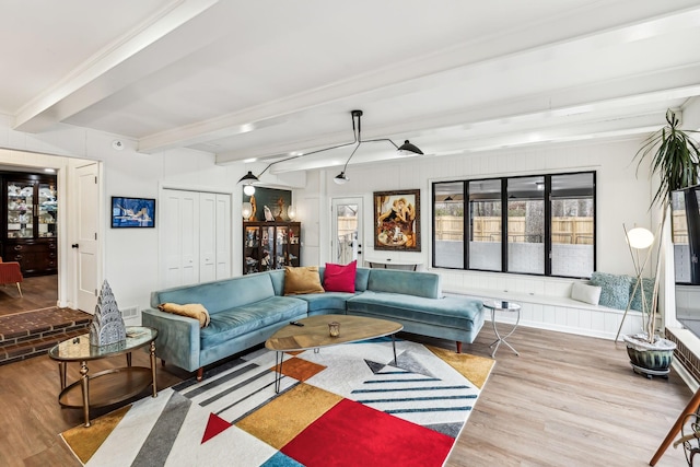 living room featuring wood-type flooring and beamed ceiling