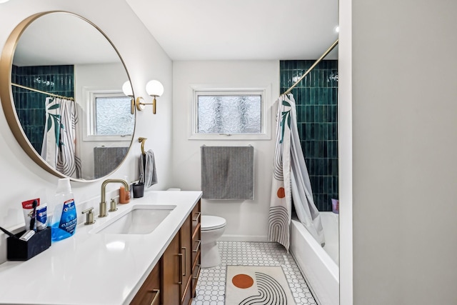 full bathroom with toilet, vanity, and shower / bath combination with curtain