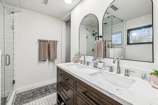 bathroom featuring tile patterned floors, walk in shower, and vanity