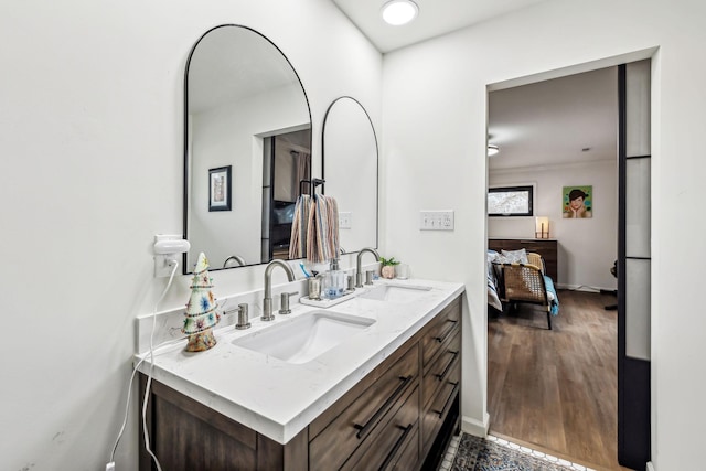 bathroom with vanity and hardwood / wood-style flooring