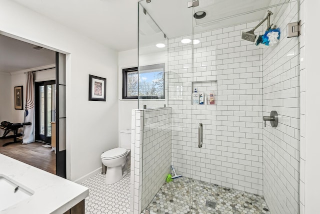 bathroom with toilet, walk in shower, tile patterned floors, and vanity