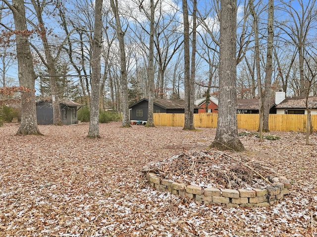 view of yard with an outdoor fire pit