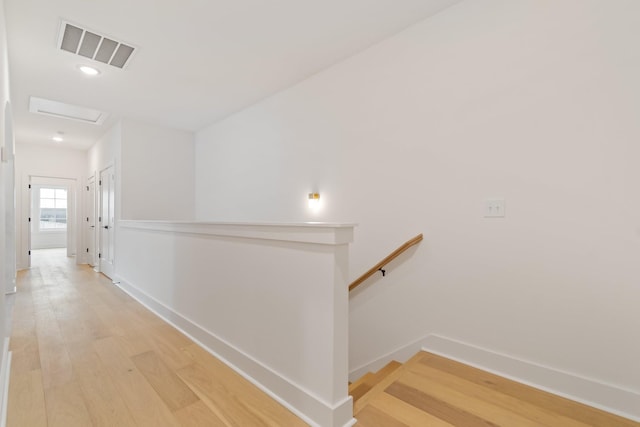 corridor featuring hardwood / wood-style flooring