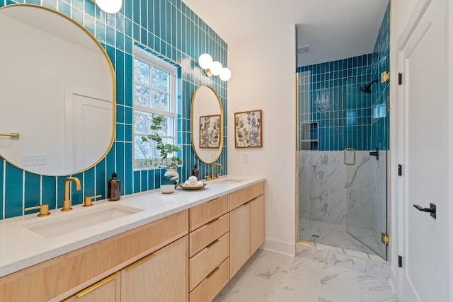 bathroom with vanity and a shower with shower door