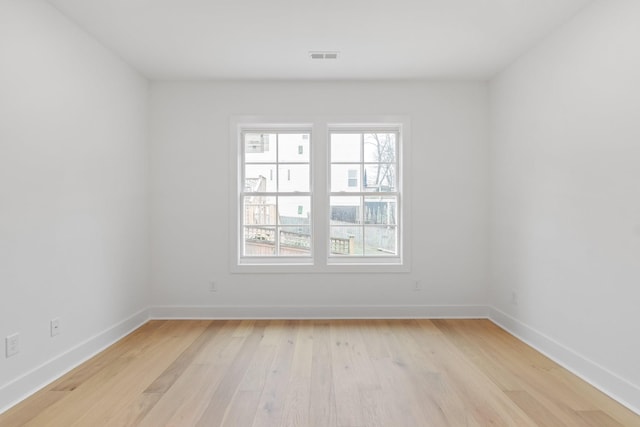 empty room featuring light hardwood / wood-style floors