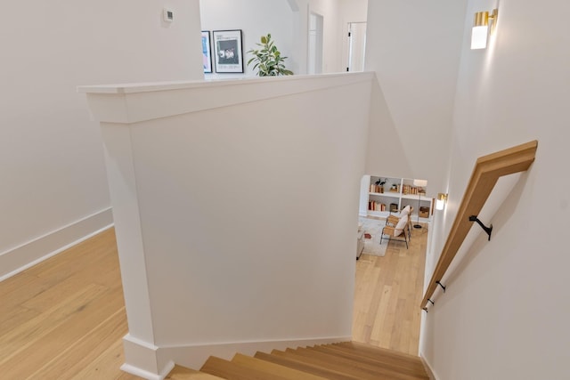 stairway featuring hardwood / wood-style floors