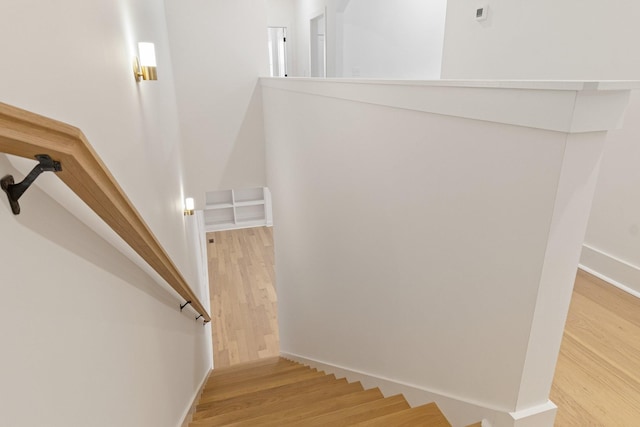 stairs with hardwood / wood-style floors