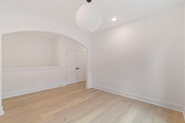 spare room featuring light hardwood / wood-style floors