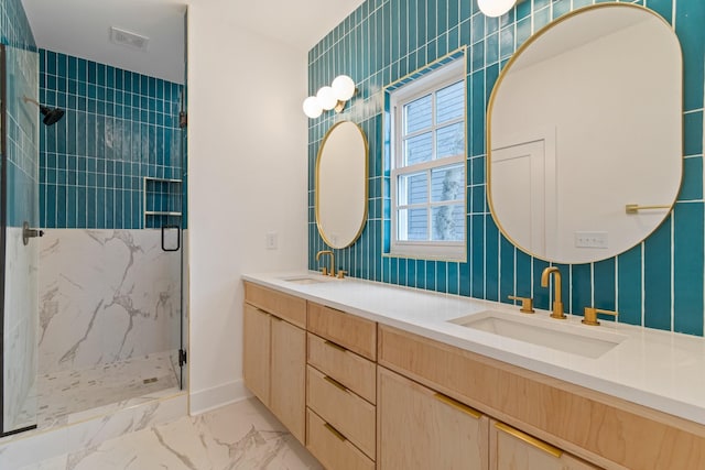 bathroom with walk in shower and vanity