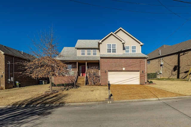 view of front of home with a garage and covered porch