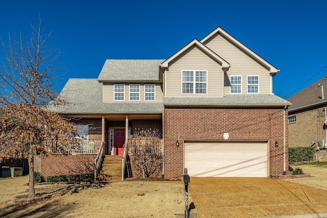 view of front of home with a garage and covered porch