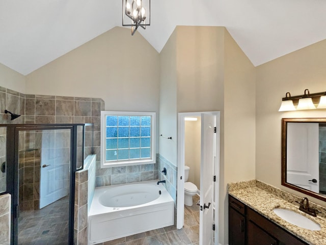 full bathroom featuring independent shower and bath, toilet, an inviting chandelier, vanity, and lofted ceiling