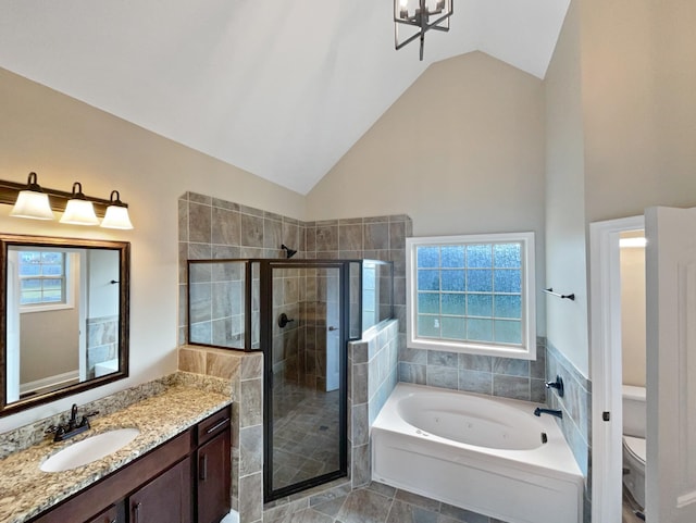 full bathroom with vanity, toilet, shower with separate bathtub, and lofted ceiling