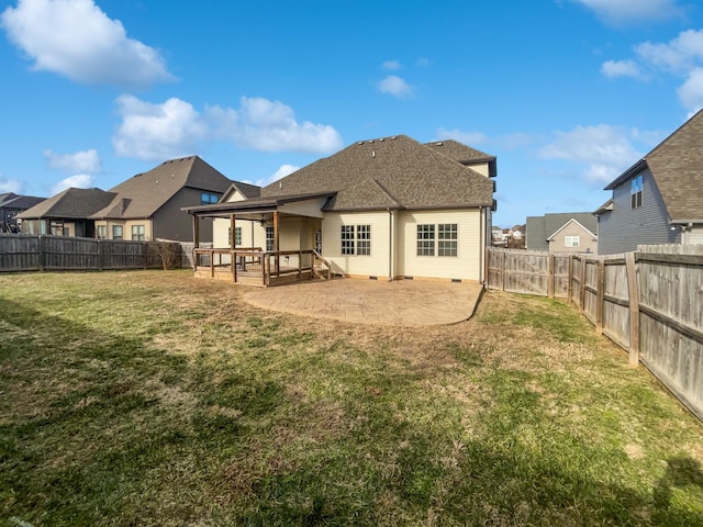 rear view of property with a patio area and a yard