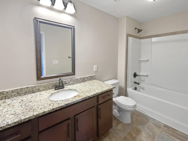 full bathroom featuring tub / shower combination, toilet, and vanity