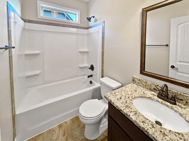 full bathroom with vanity, washtub / shower combination, and toilet