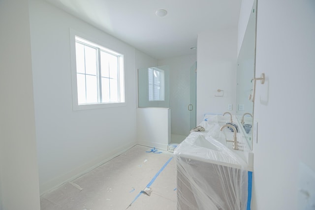 bathroom featuring an enclosed shower