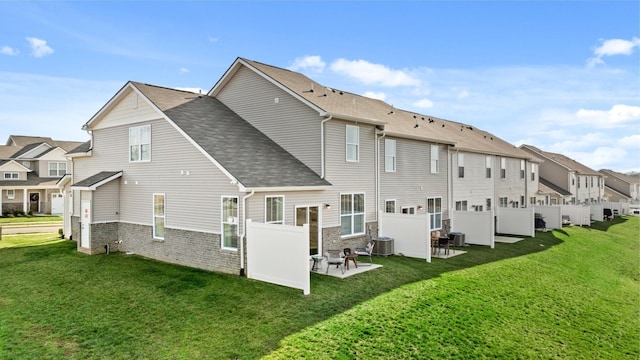 back of house with a patio area, central AC unit, and a yard