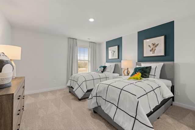 bedroom featuring light colored carpet