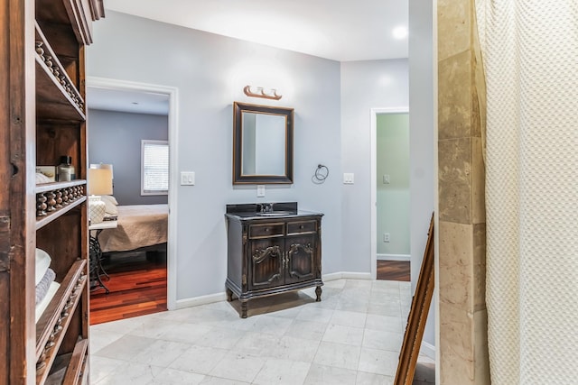 bathroom featuring vanity and a shower with shower curtain