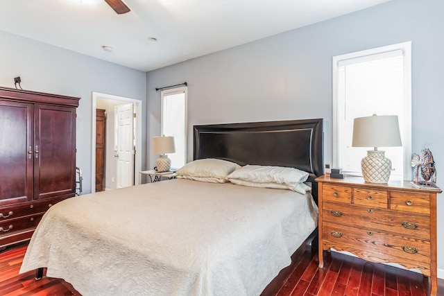 bedroom featuring ceiling fan and dark hardwood / wood-style flooring