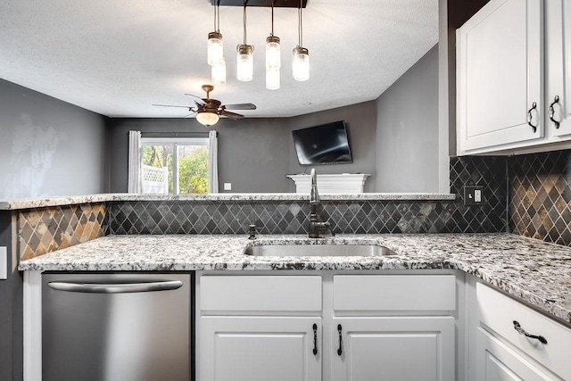 kitchen with a textured ceiling, dishwasher, decorative light fixtures, white cabinetry, and sink