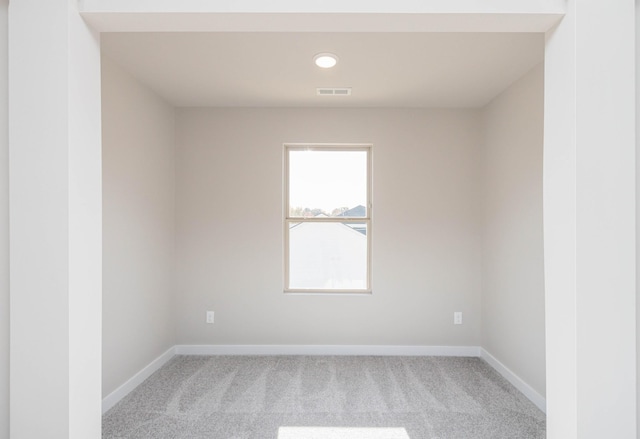 spare room with light colored carpet