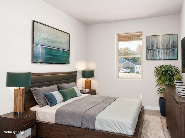 bedroom with light carpet