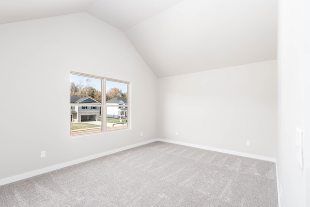 bonus room with carpet floors and lofted ceiling