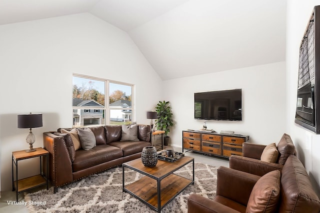 living room featuring vaulted ceiling