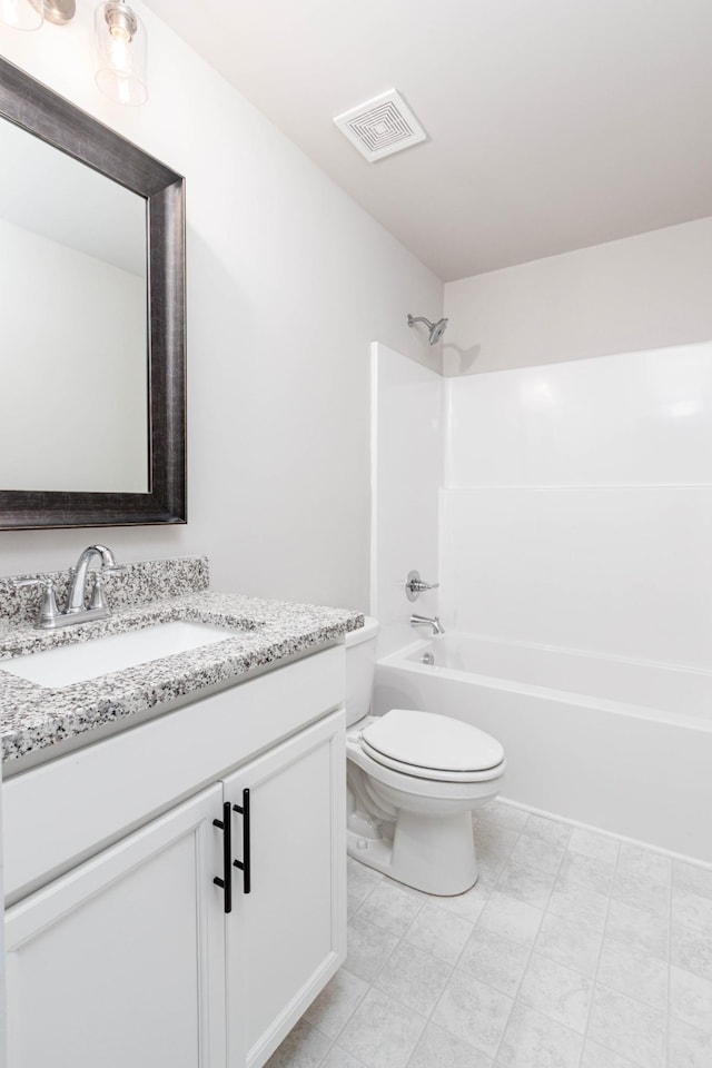 full bathroom with toilet, vanity, and bathing tub / shower combination