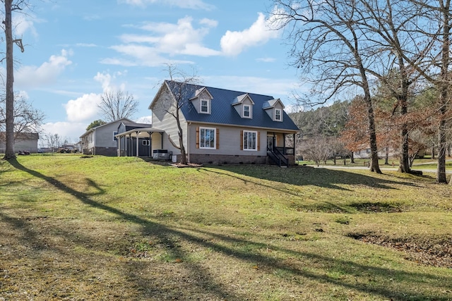 view of front of home featuring a front lawn and a carport