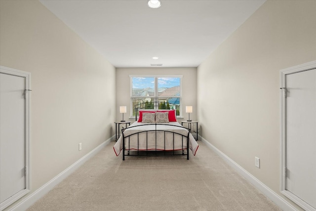 bedroom with light carpet