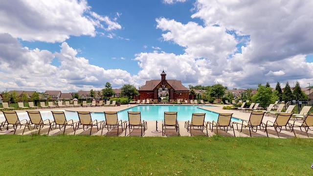 view of swimming pool with a lawn and a patio