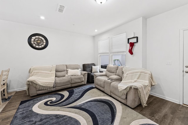 living room featuring dark wood-type flooring