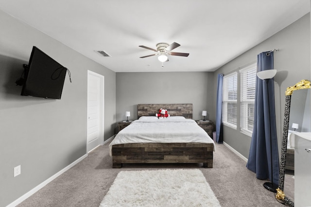 bedroom with ceiling fan and carpet