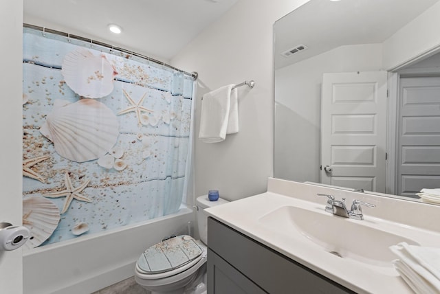 full bathroom featuring vanity, shower / bath combination with curtain, and toilet