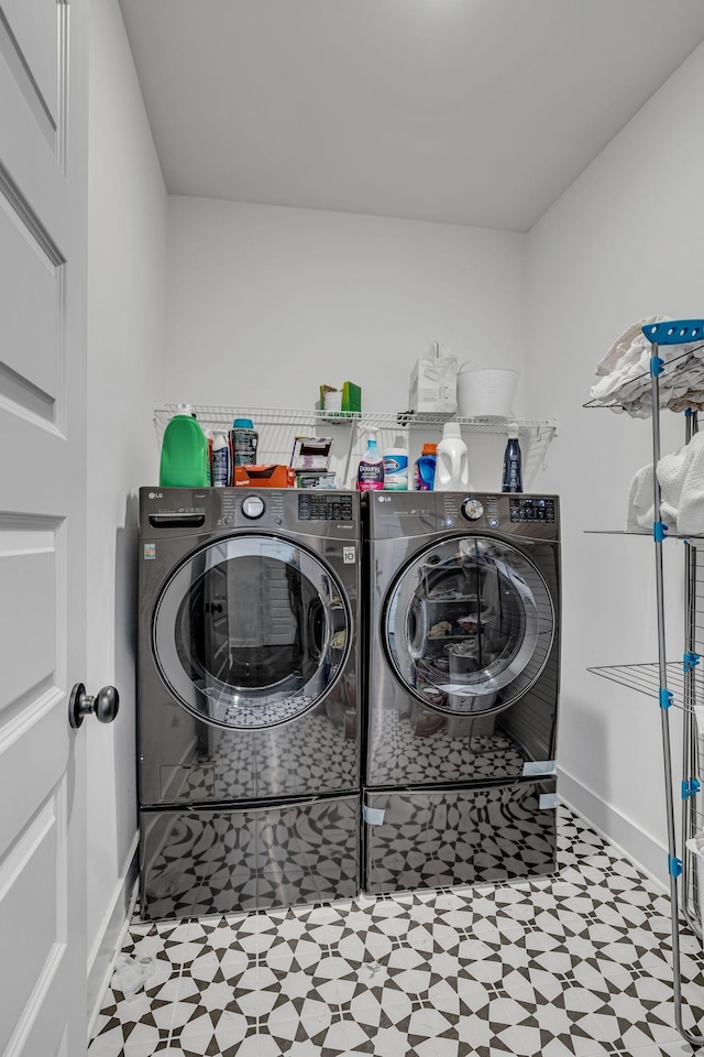 washroom with washer and dryer