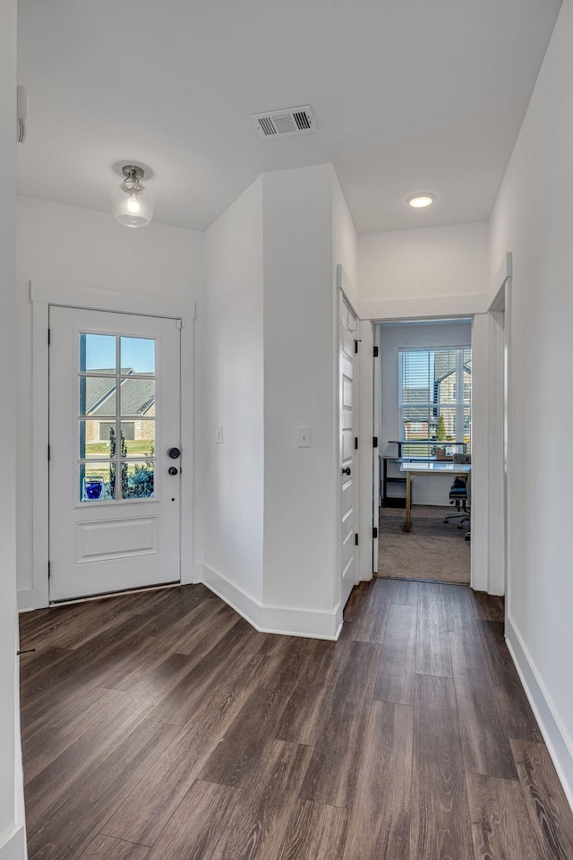 foyer with dark hardwood / wood-style floors