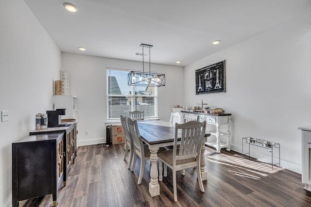 dining space featuring dark hardwood / wood-style floors