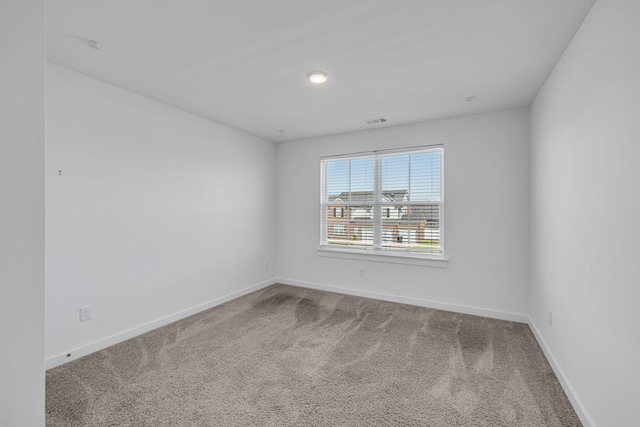 spare room featuring carpet flooring