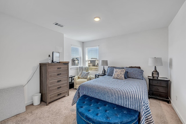 bedroom featuring light colored carpet