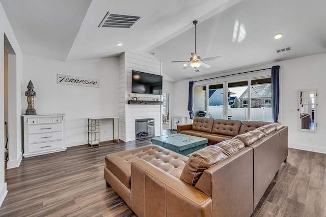 living room featuring a fireplace, hardwood / wood-style flooring, ceiling fan, and lofted ceiling